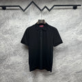Black Gucci polo shirt with button placket and subtle GG pattern
