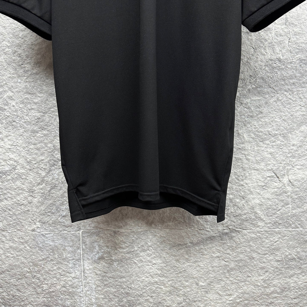 Black Gucci polo shirt hem with side seam detail