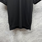 Black Gucci polo shirt hem with side seam detail