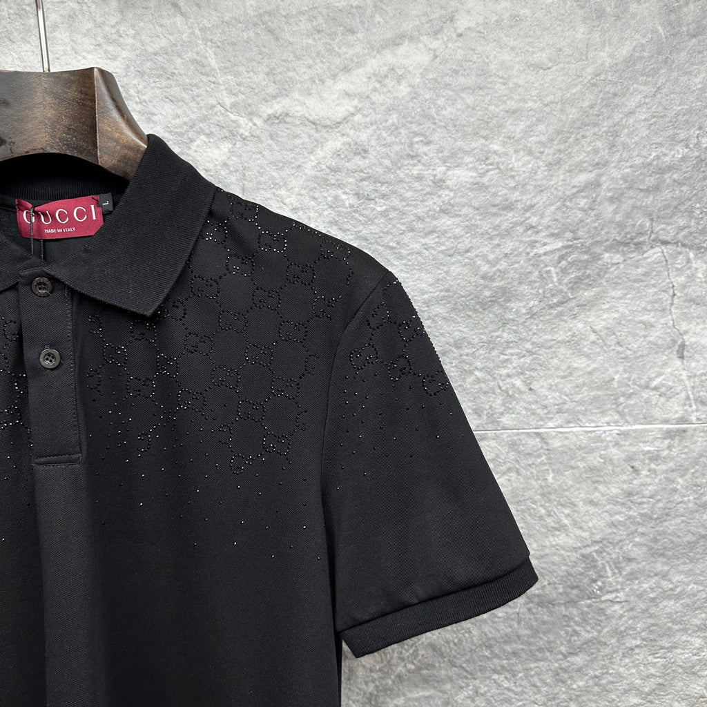 Black Gucci polo shirt sleeve with GG pattern and textured dots