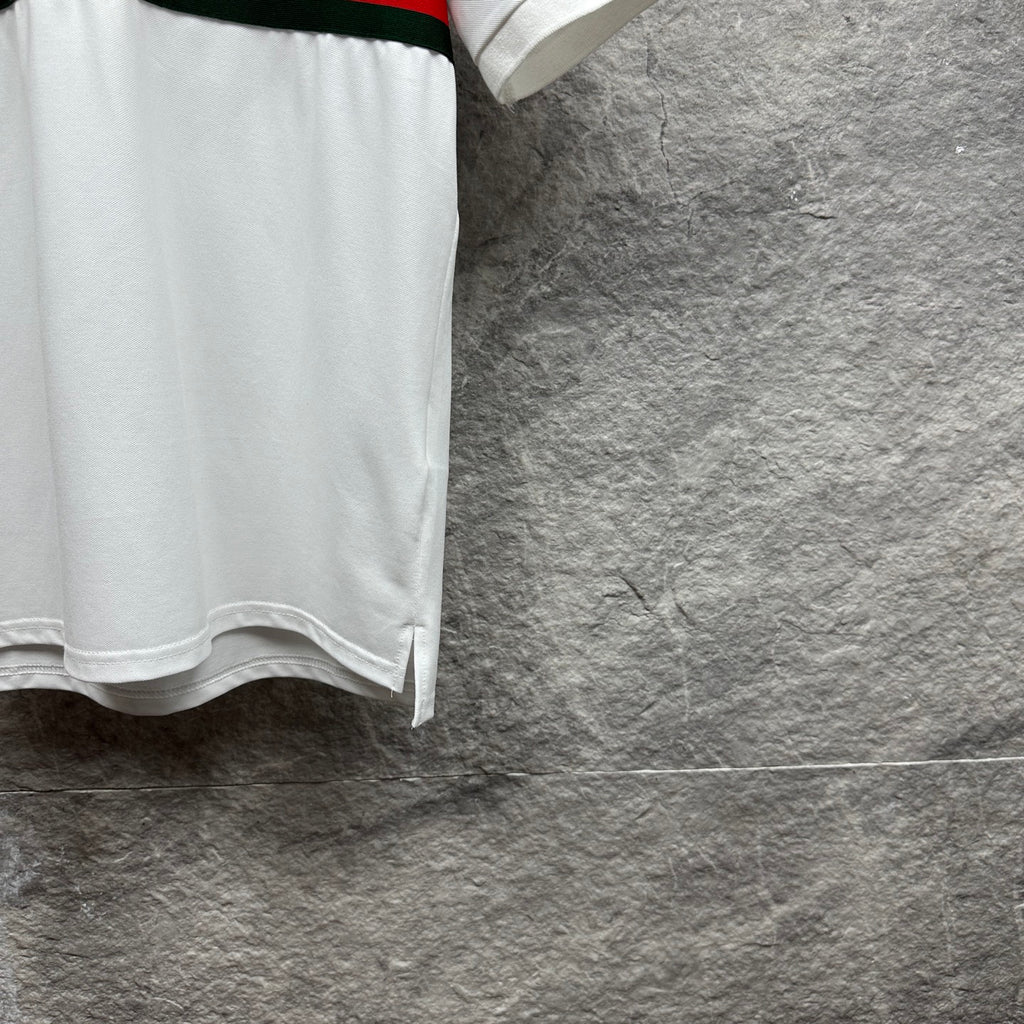 Gucci polo shirt in white with short sleeves and side slit at the hem