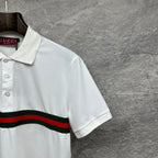 Gucci polo shirt in white, side view with short sleeves and red and green striped band