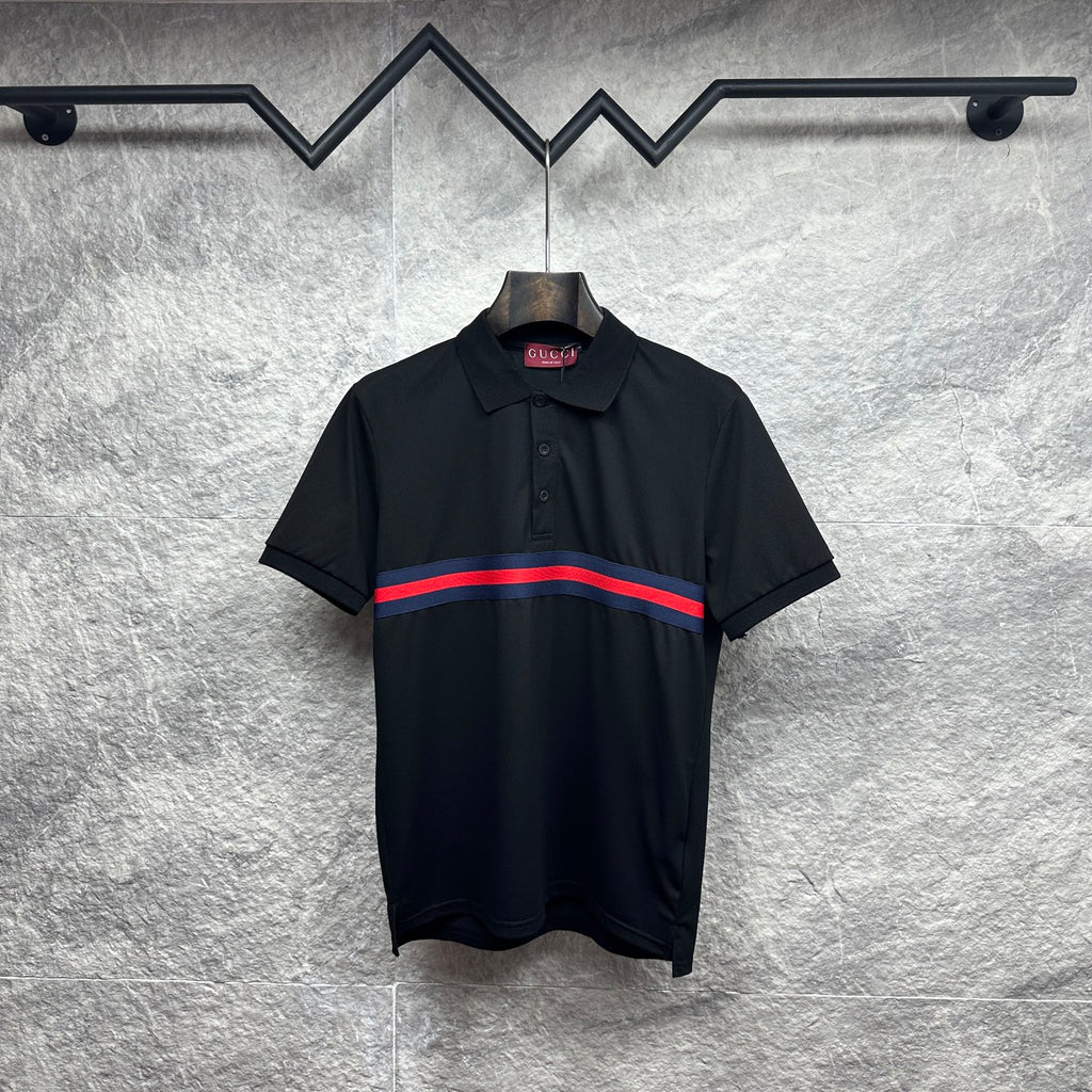 Black Gucci polo shirt with striped band at chest and buttoned collar.