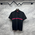 Black Gucci polo shirt with striped band at chest and buttoned collar.