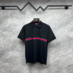 Black Gucci polo shirt with striped band at chest and buttoned collar.