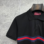 Black Gucci polo shirt close-up of collar and striped chest band.