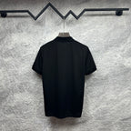 Black Gucci polo shirt back view with short sleeves and no visible graphics.