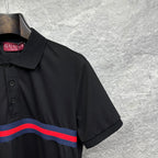 Black Gucci polo shirt shoulder and collar detail with striped chest band.