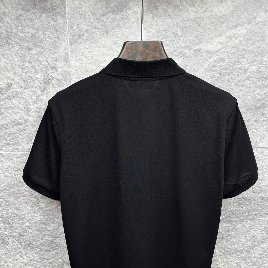 Black Gucci polo shirt back view with short sleeves on hanger.