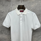White Gucci polo shirt with pointed collar, button placket, and GUCCI neck label