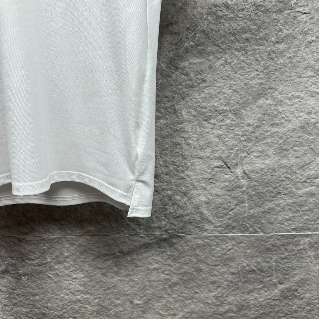 White Gucci polo shirt lower hem detail with stitched edge