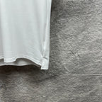 White Gucci polo shirt lower hem detail with stitched edge