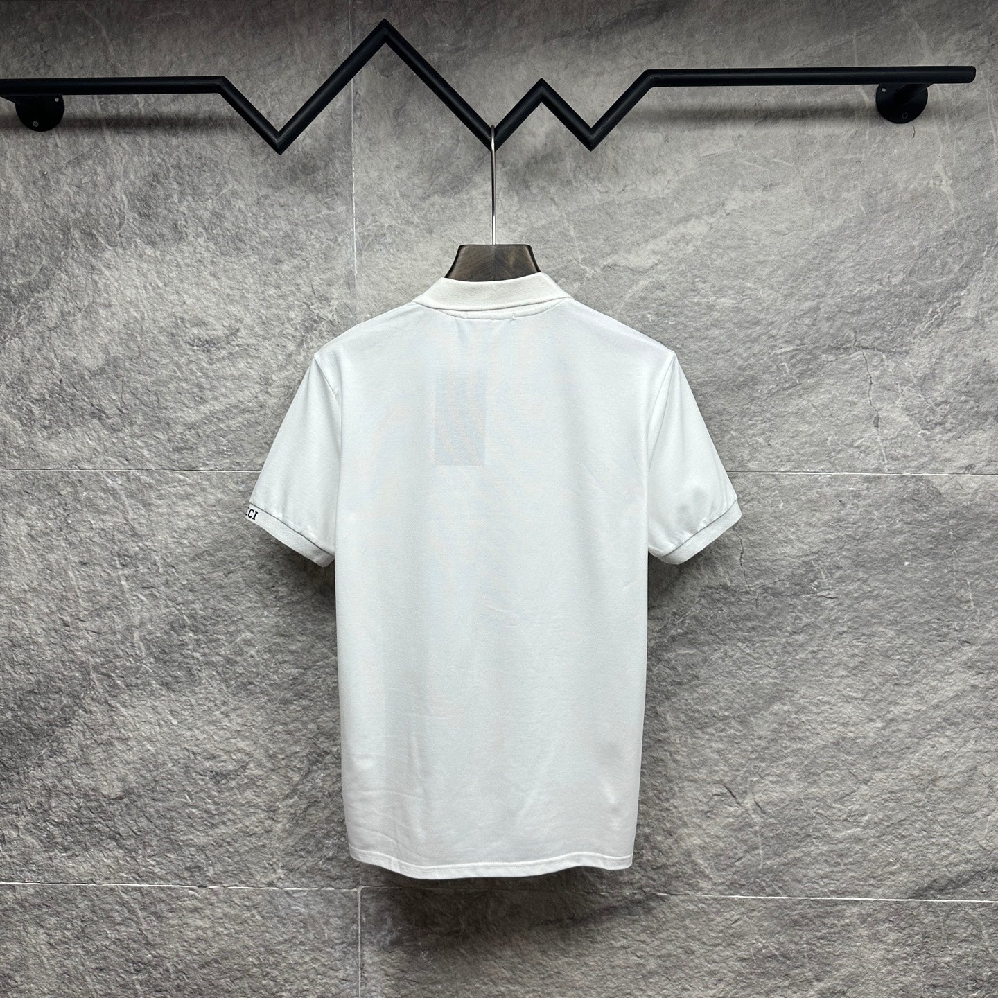 White Gucci polo shirt, back view with ribbed collar and short sleeves