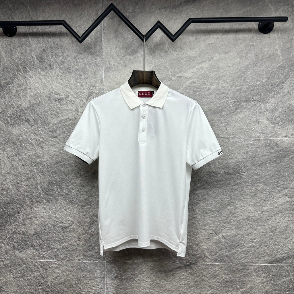 White Gucci polo shirt with button placket and embroidered logo on sleeve