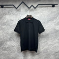 Black Gucci polo shirt with button placket and short sleeves