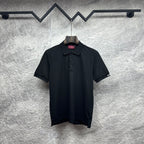 Black Gucci polo shirt with button placket and short sleeves