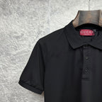 Black Gucci polo shirt with dark button placket and fold-over collar