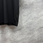 Black Gucci polo shirt lower side seam and curved hem
