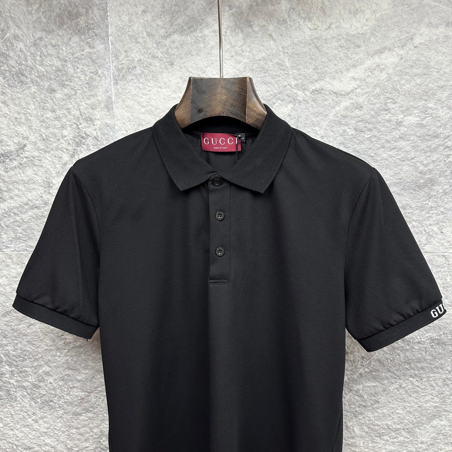 Black Gucci polo shirt front with fold-over collar and button placket