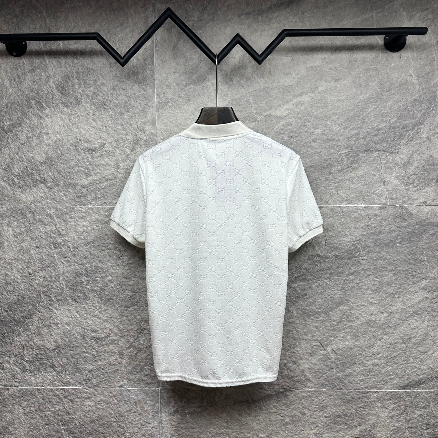 Gucci short-sleeve polo shirt, white GG pattern, back view with curved hem