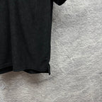 Black Gucci polo shirt, side hem and sleeve edge detail, GG monogram pattern.