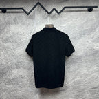 Black Gucci polo shirt, back view, short sleeves, GG monogram pattern.