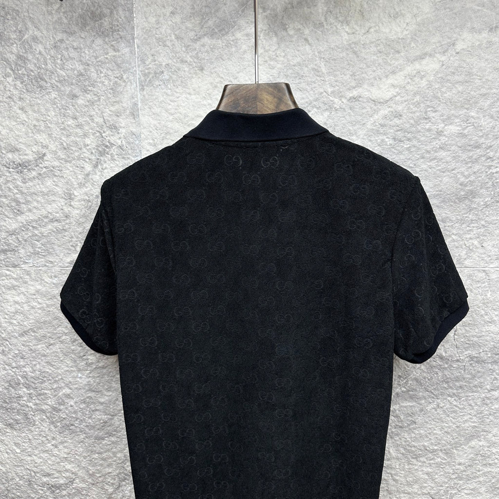 Black Gucci polo shirt, back collar and shoulder view, short sleeves, GG monogram.