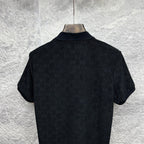 Black Gucci polo shirt, back collar and shoulder view, short sleeves, GG monogram.