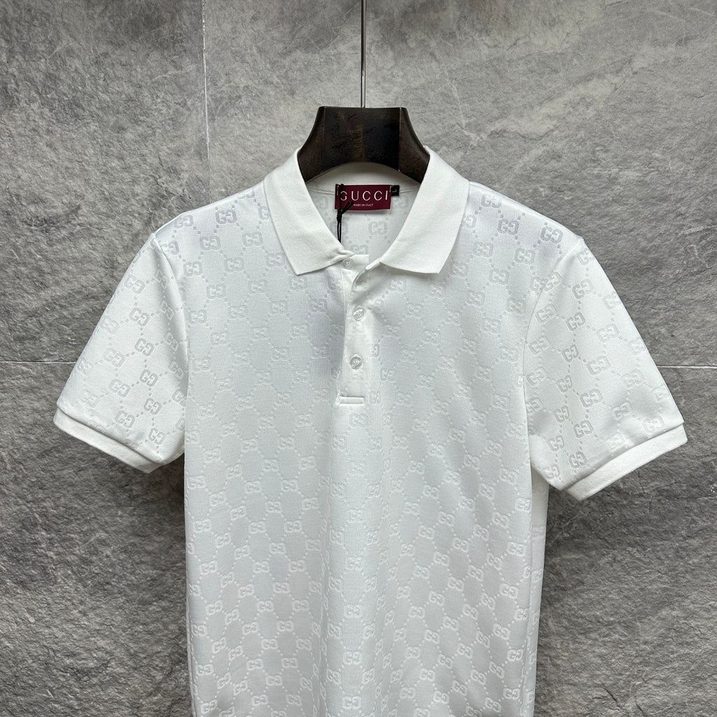 White Gucci polo shirt with subtle GG monogram pattern, short sleeves, button front