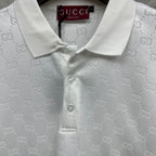 White Gucci polo shirt neckline close-up with GG pattern and buttoned collar
