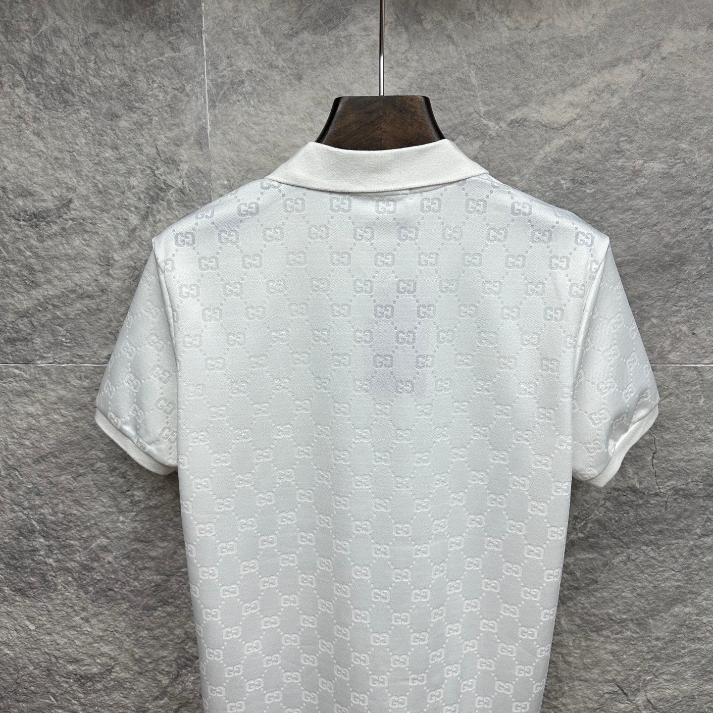 White Gucci polo shirt back view with allover GG monogram pattern, short sleeves