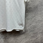 White Gucci polo shirt side view with GG pattern, sleeve cuff and hem