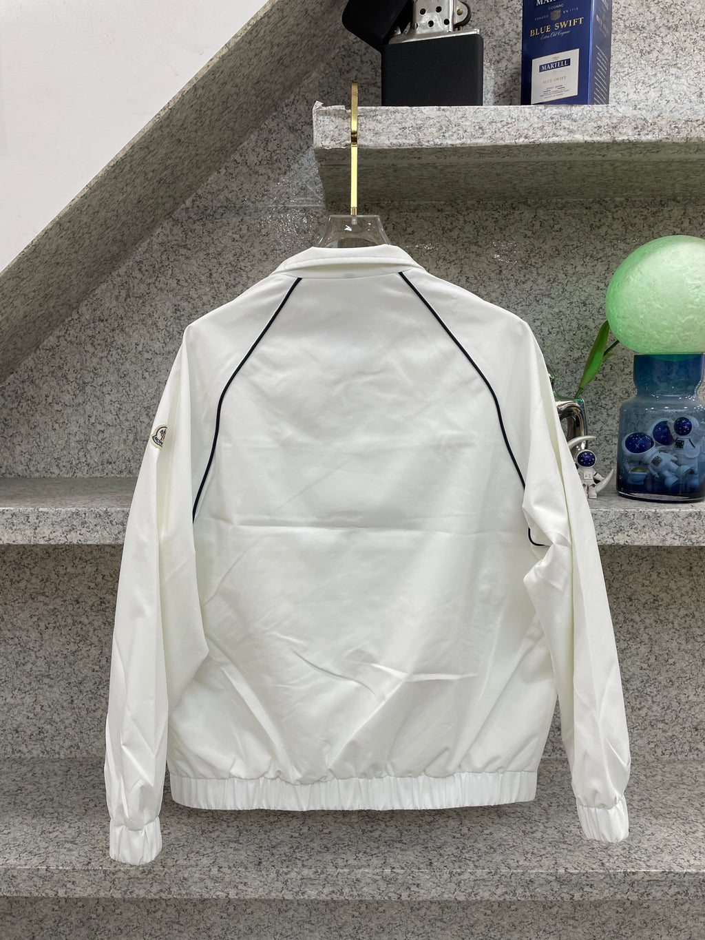 Moncler jacket back, white with navy-trim shoulder seam and elastic hem