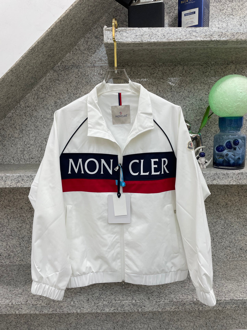 Moncler jacket front, white with navy/red logo stripe and stand collar