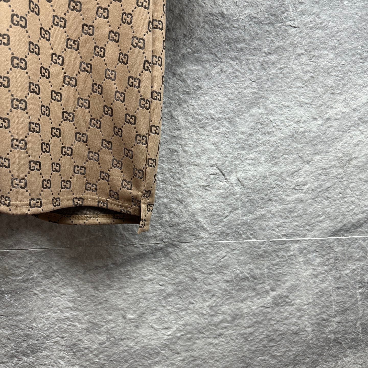 Beige GG monogram polo shirt hem detail, ribbed trim