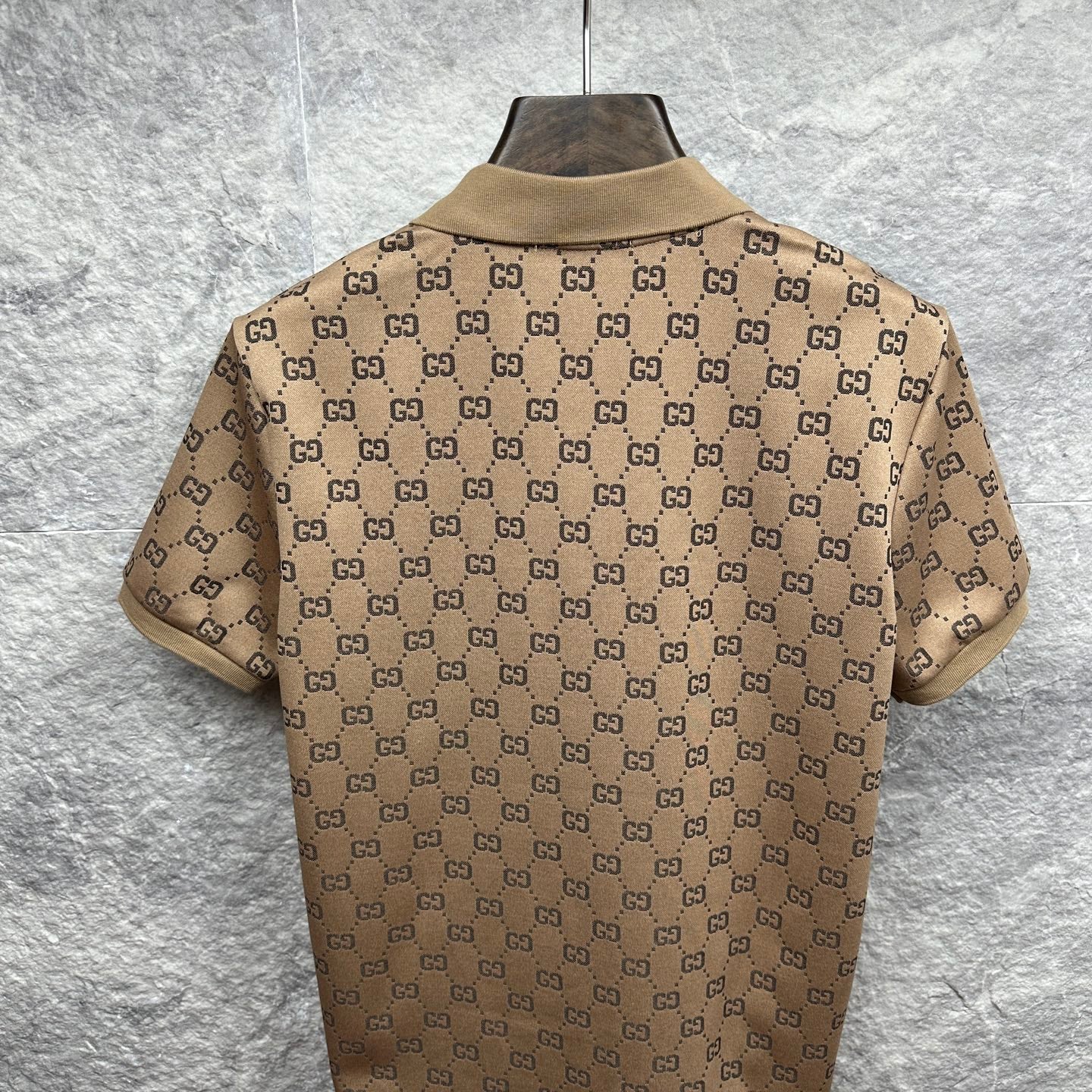 Beige GG monogram polo shirt, back view with ribbed collar and short sleeves