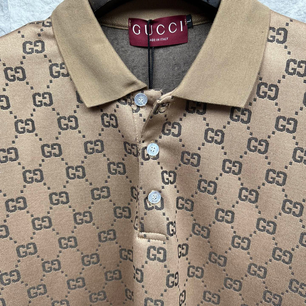 Beige GG monogram polo shirt with tan collar, button placket and Gucci label