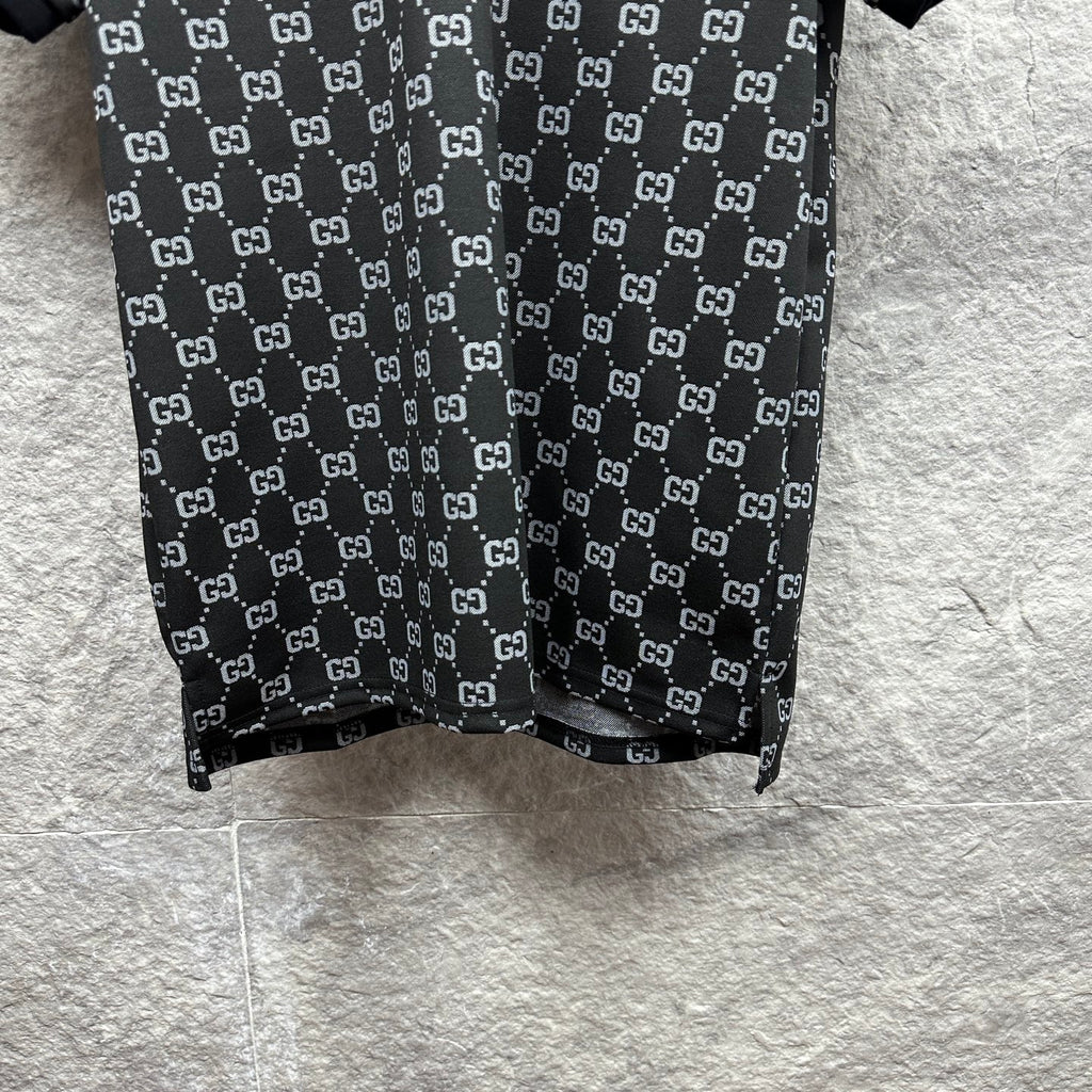 Gucci polo shirt hem view, dark navy GG pattern with straight bottom