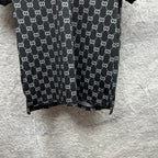 Gucci polo shirt hem view, dark navy GG pattern with straight bottom