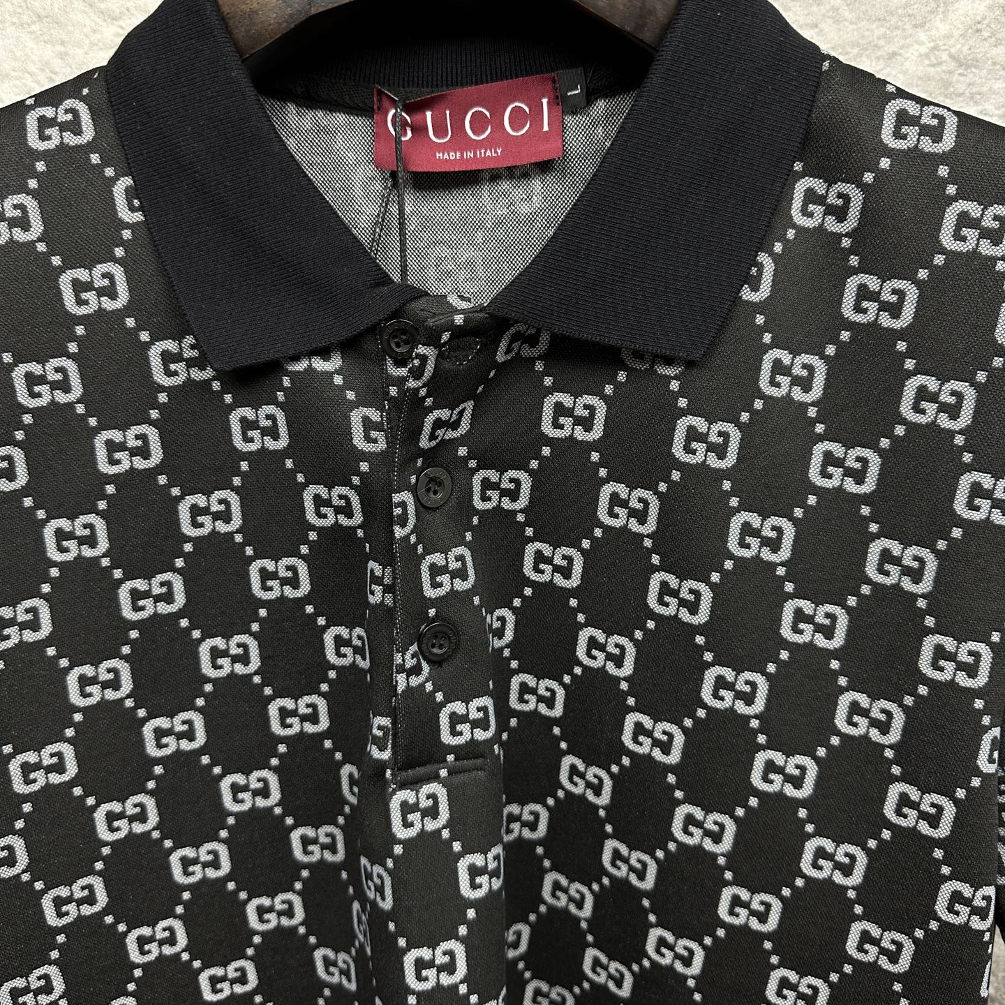 Gucci polo shirt collar detail, dark navy GG pattern with button front