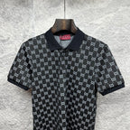 Gucci polo shirt close-up, dark navy GG pattern with collared button front