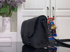 Louis Vuitton crossbody bag in dark monogram canvas, side view with adjustable strap