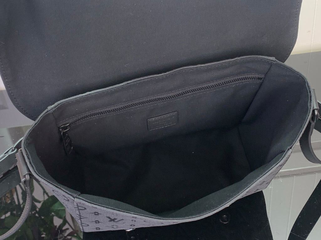 Louis Vuitton bag interior view with zipped lining and dark fabric lining