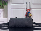 Louis Vuitton bag in dark monogram canvas, front view with crossbody strap