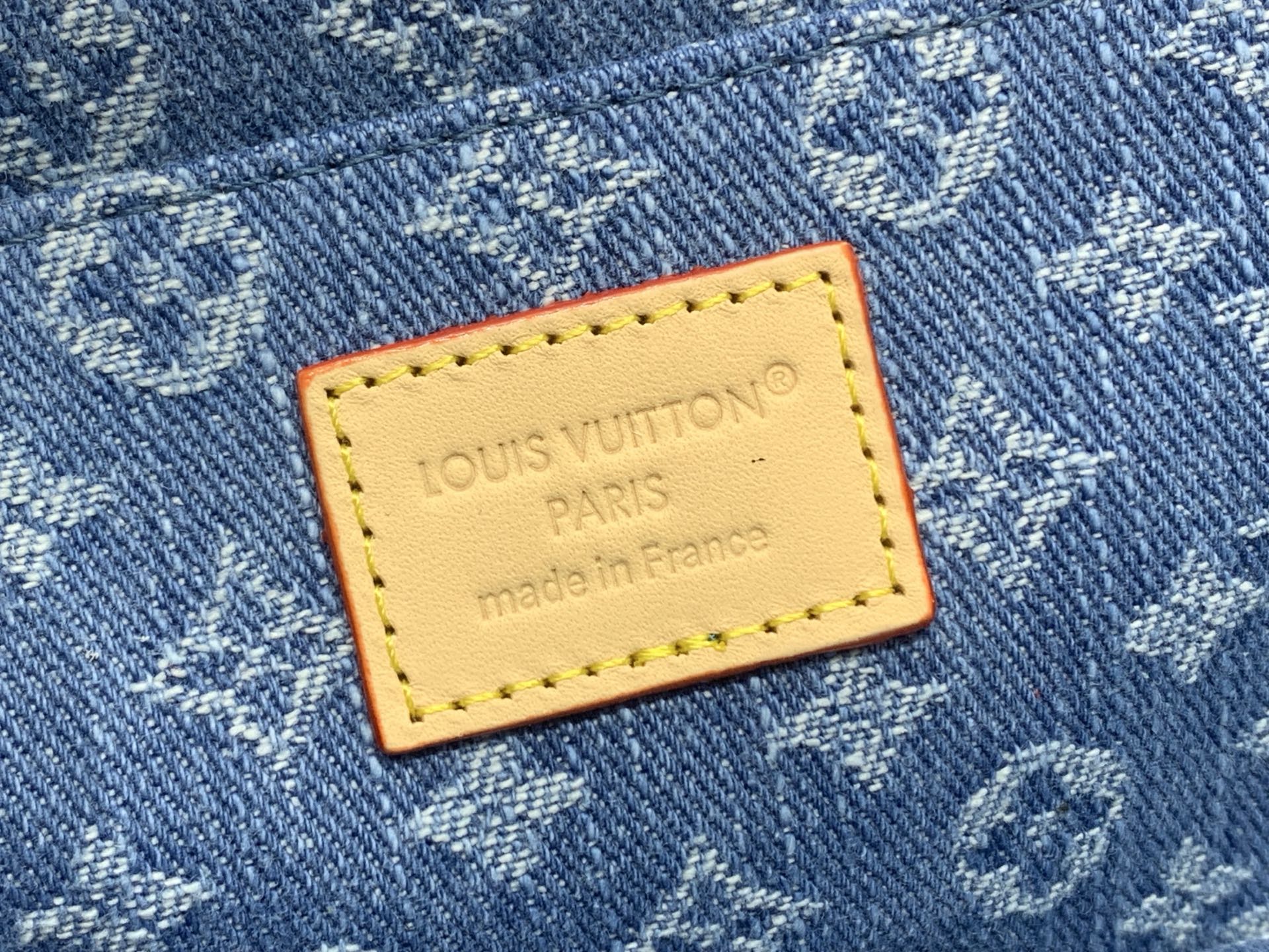 Louis Vuitton Paris made in France leather patch on blue monogram canvas