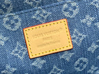 Tan leather brand patch on blue monogram bag: Louis Vuitton Paris, made in France.