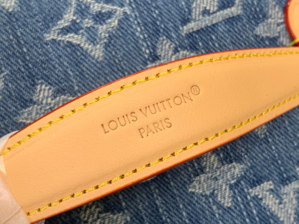 Louis Vuitton Paris leather label on blue monogram canvas with orange stitching