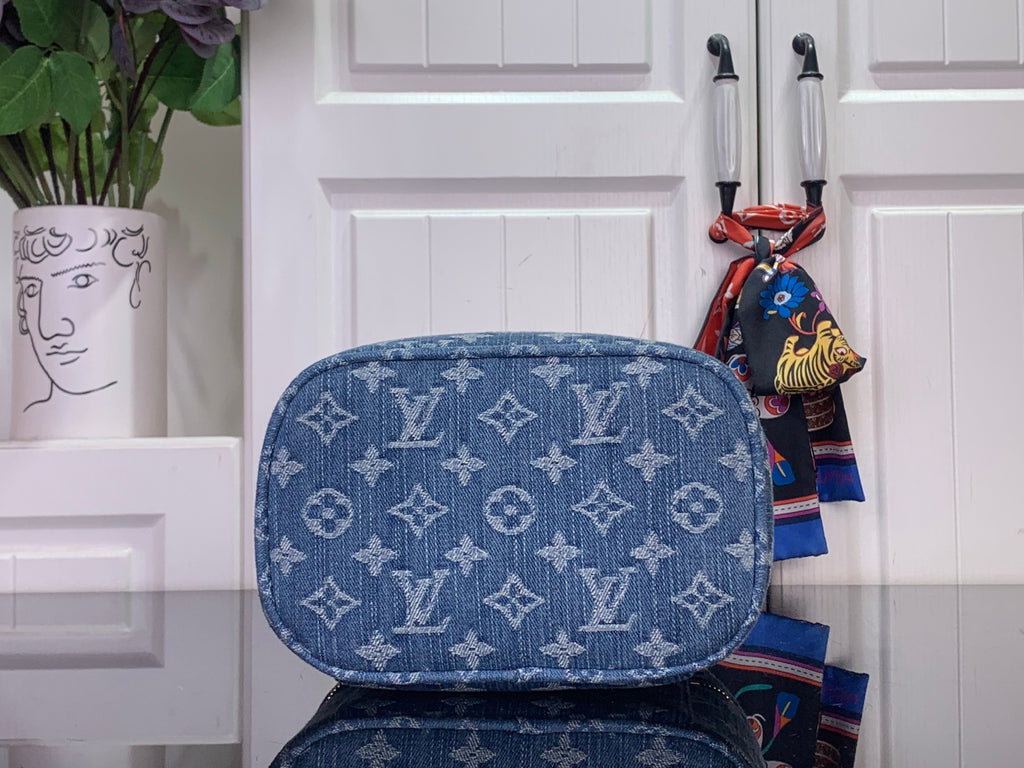 Louis Vuitton blue monogram canvas bag with rounded top and gold zipper