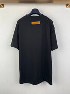 Louis Vuitton T-shirt back view with yellow label, dark black