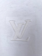 White knit T-shirt fabric close-up, showing fine weave texture.